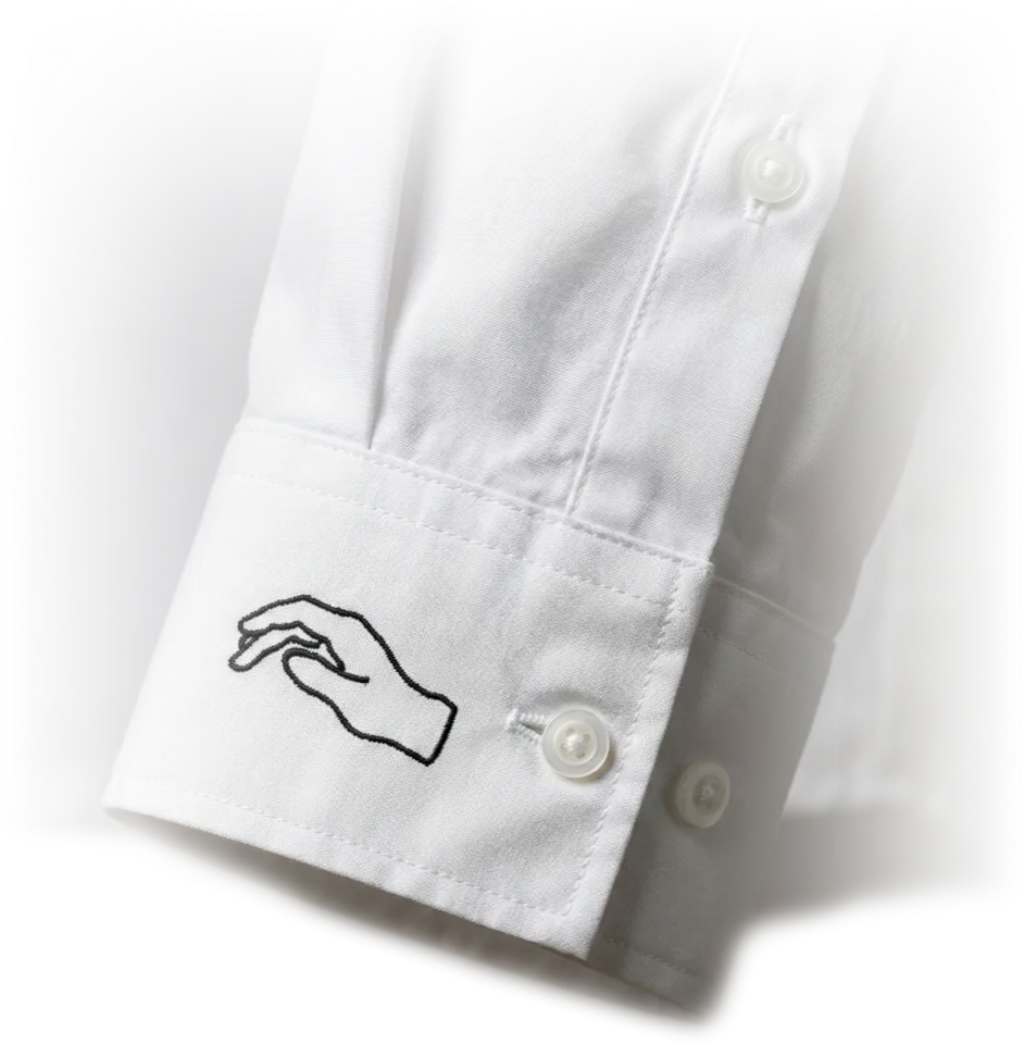 Embroidered shirt cuff detail — hand logo on cuff